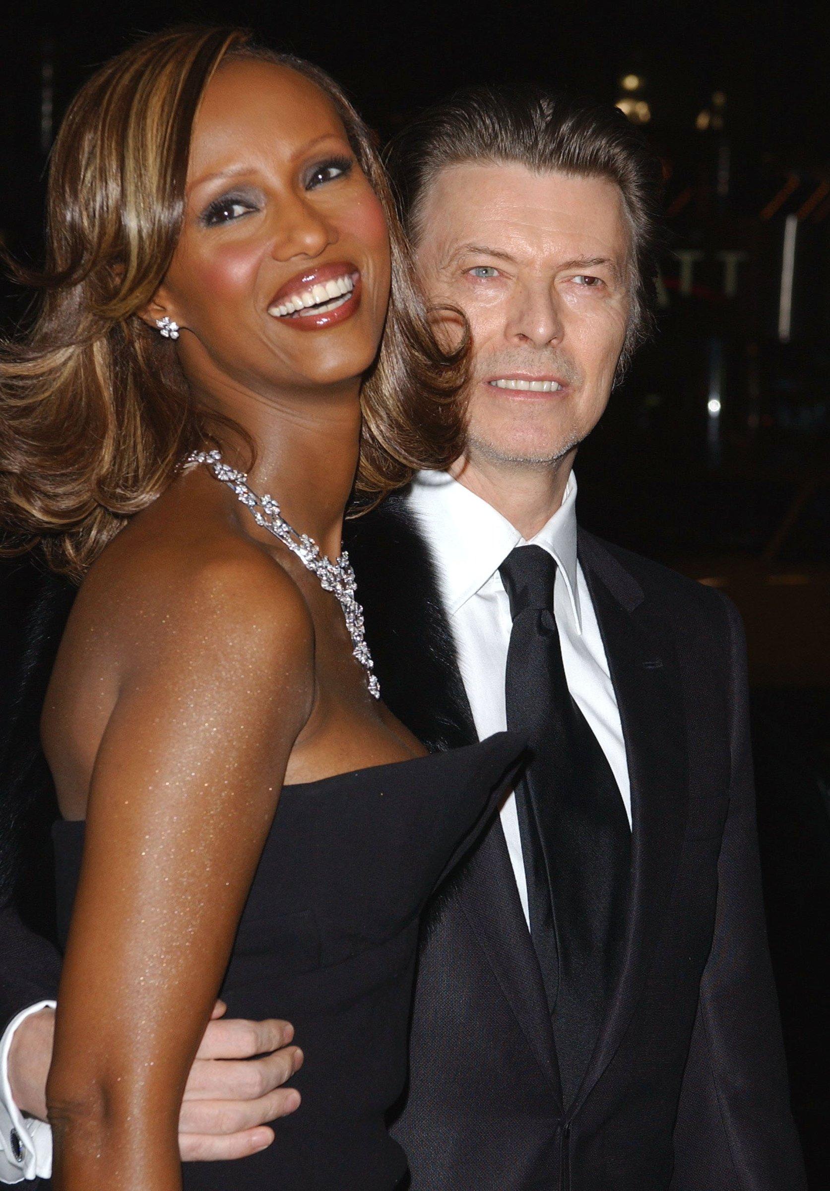 Singer David Bowie and his wife Iman arrrive at Cipriani's 42nd Street to attend the amfAR's New York annual benefit gala, Monday February 3, 2003.