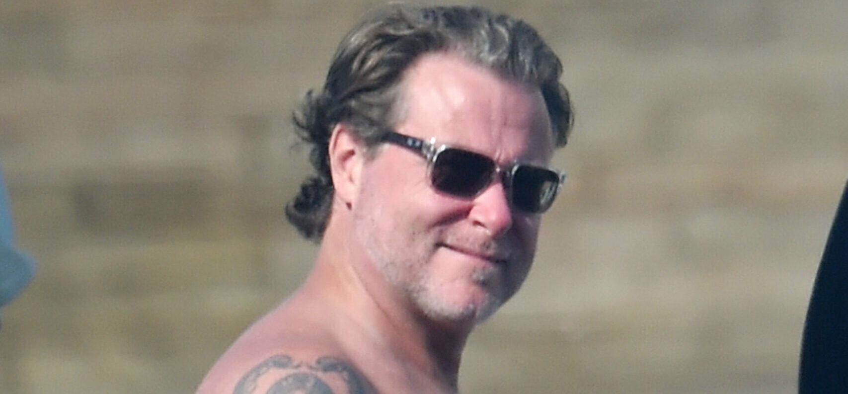 Tori Spelling slips into her swimsuit with Dean McDermott at a Mother apos s Day pool party at the beach with the family