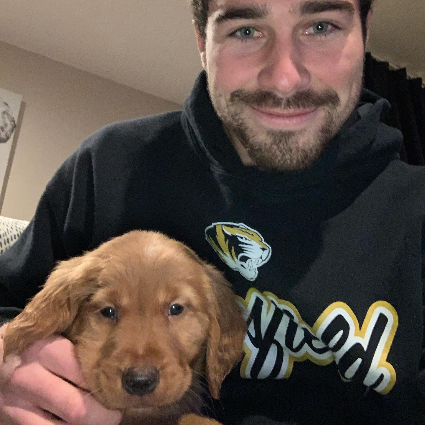 Cole Barnett with a puppy