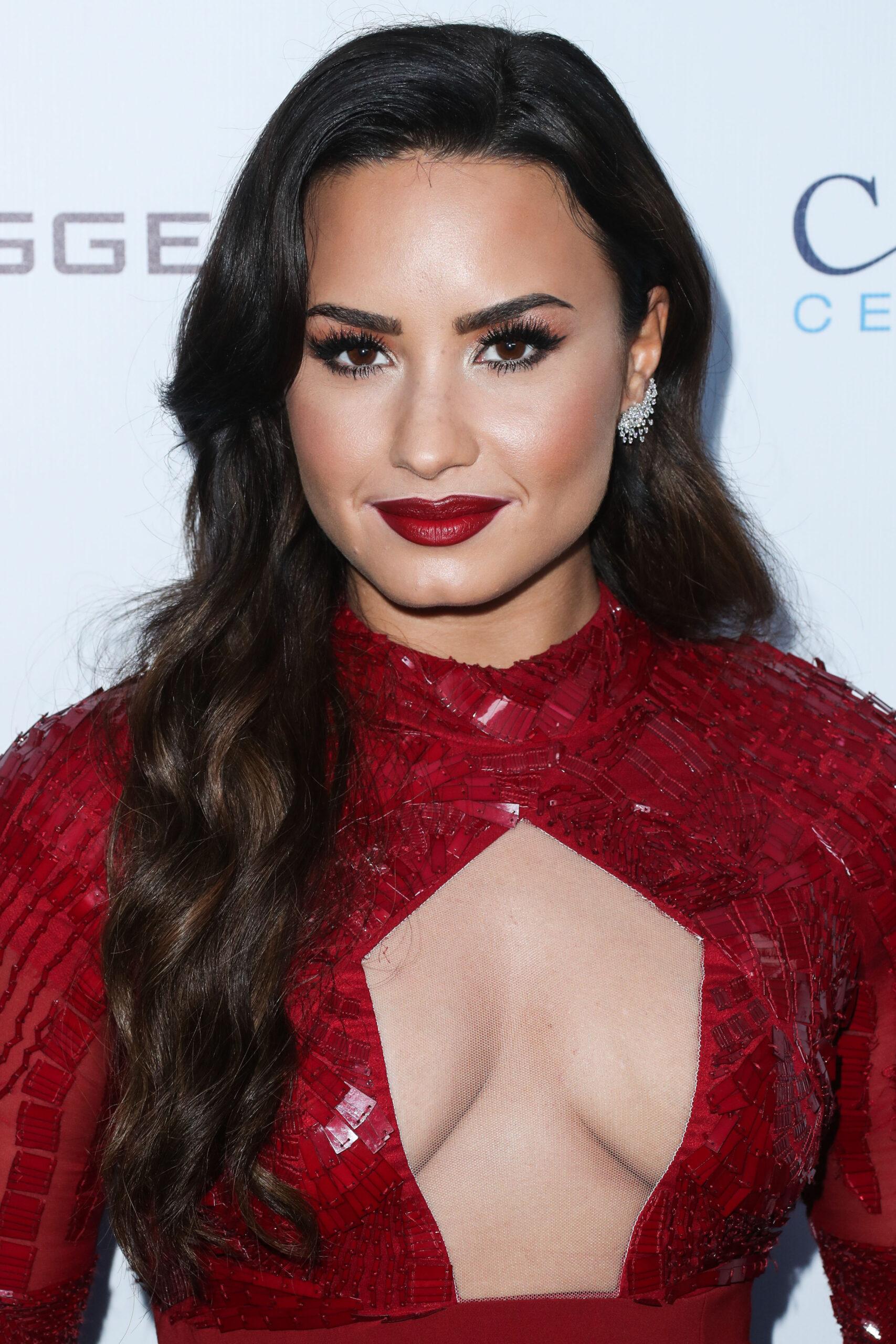 Demi Lovato at an event in a red dress