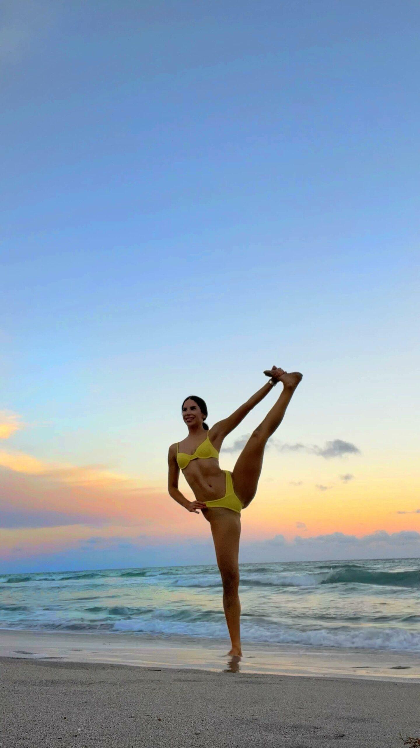 Jen Selter does yoga on the beach in a yellow bikini