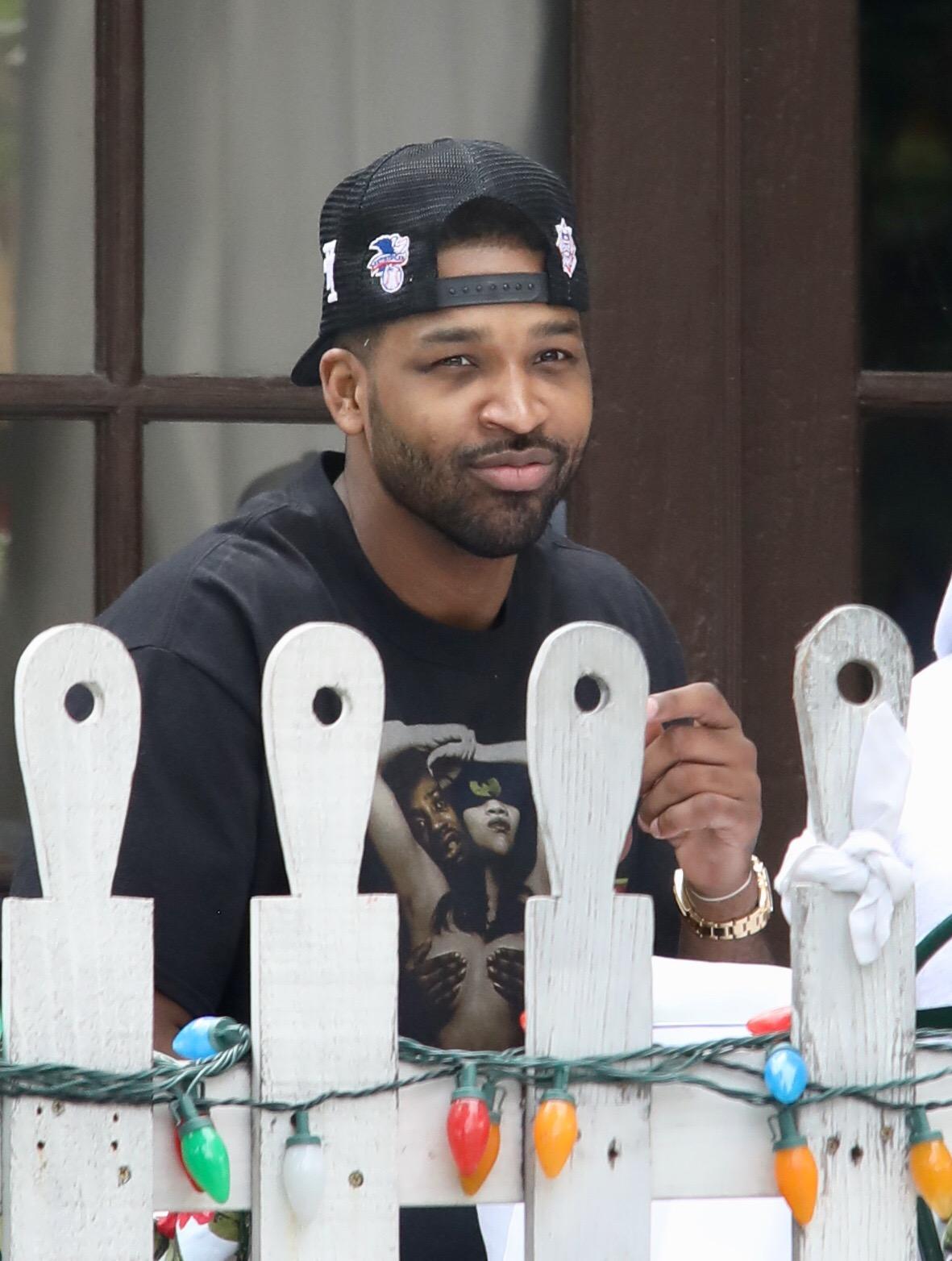 Tristan Thompson seen days after baby True's 1st birthday drinking champagne and eating pizza at The Ivy