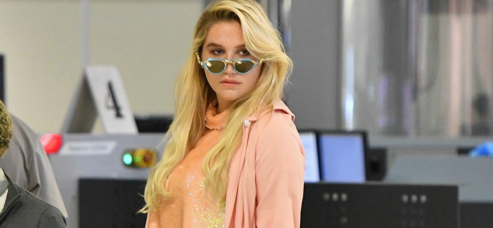 Kesha seen heading through security at LAX