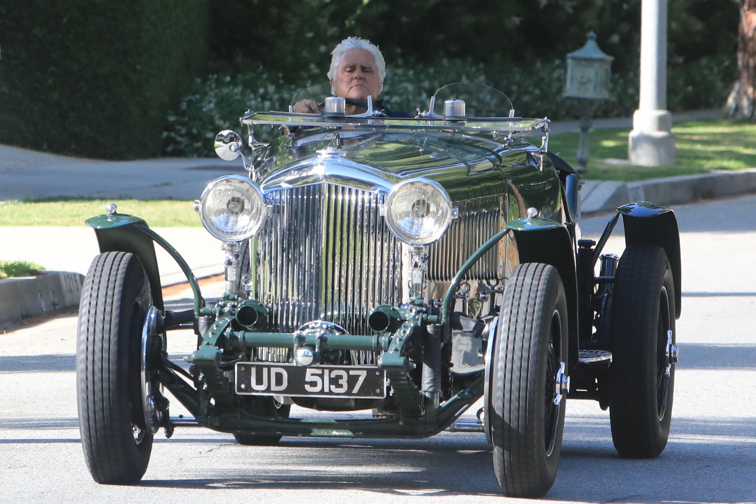 Jay Leno cruising in one of his collectables cars around Beverly Hills