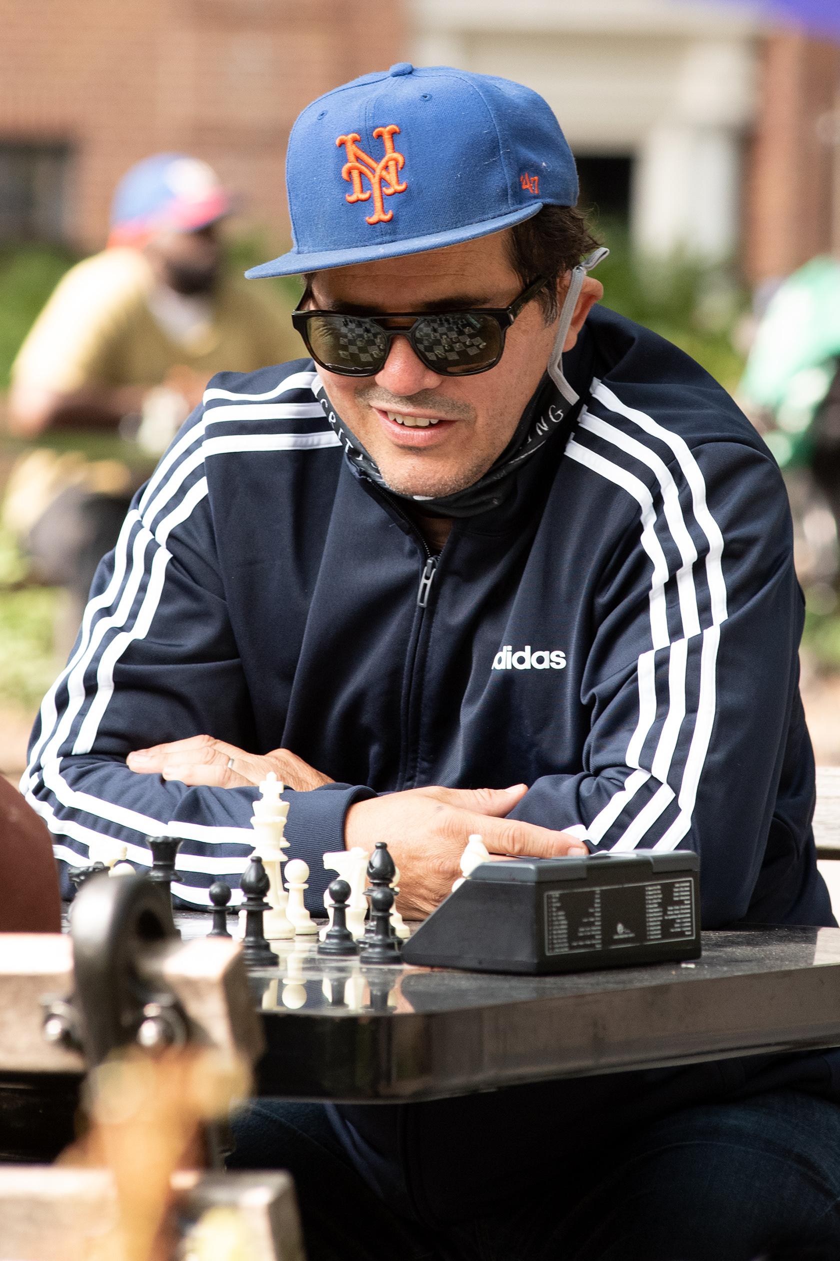 John Leguizamo Plays Chess in Washington Square Park