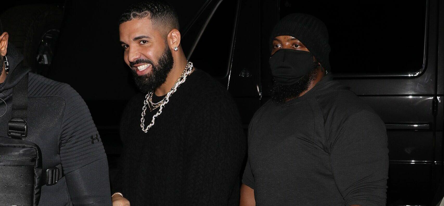 Rapper Drake is all smiles as he heads to the Nice Guy Restaurant to party