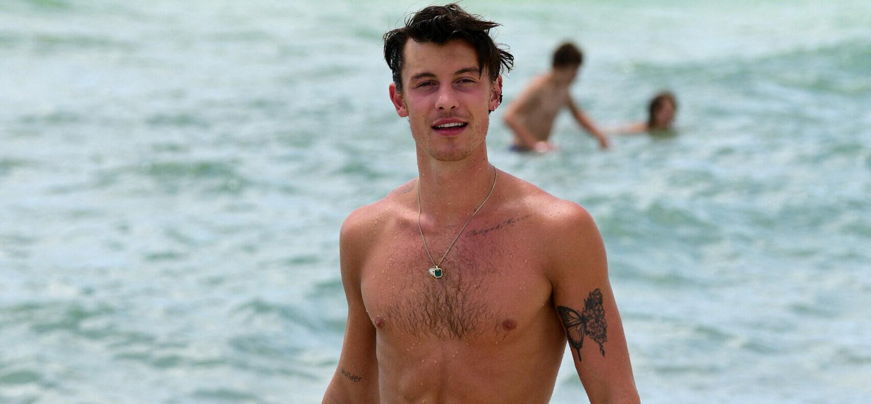 Shirtless Shawn Mendes looks happy as he has fun on the beach on his birthday in Miami