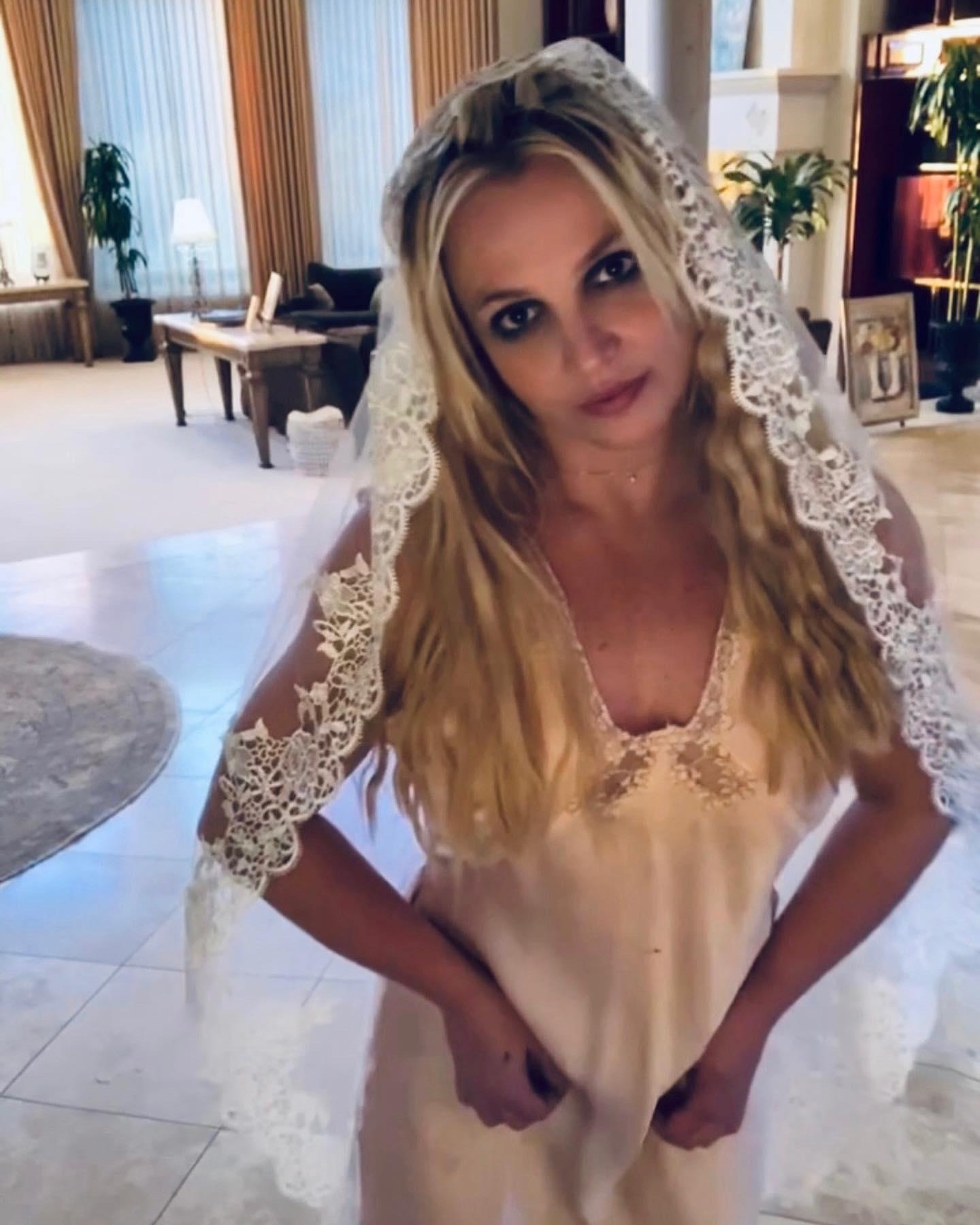 Britney Spears wears a wedding veil