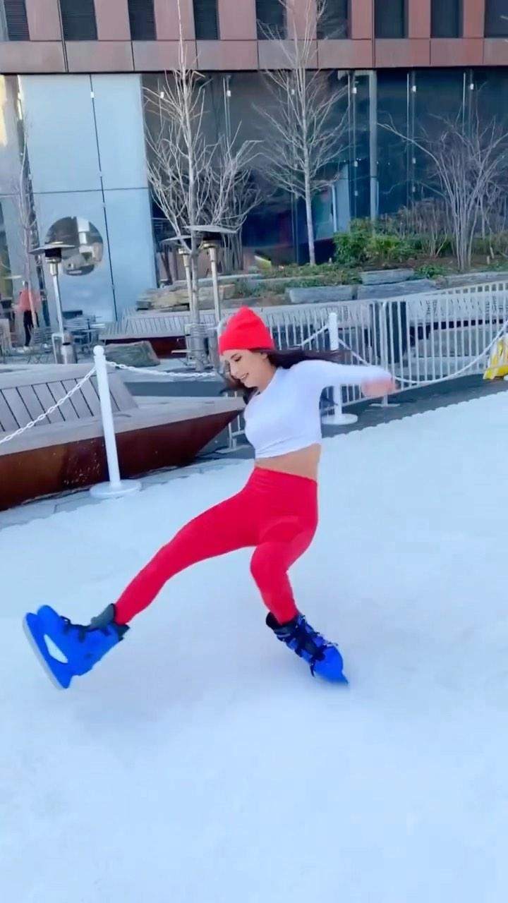 Jen Selter trips and falls while ice skating