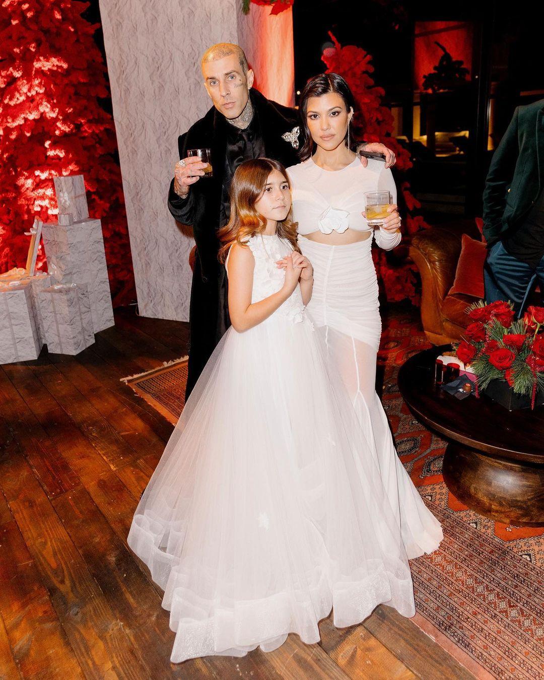 Kourtney Kardashian and Travis Barker with Penelope for Christmas