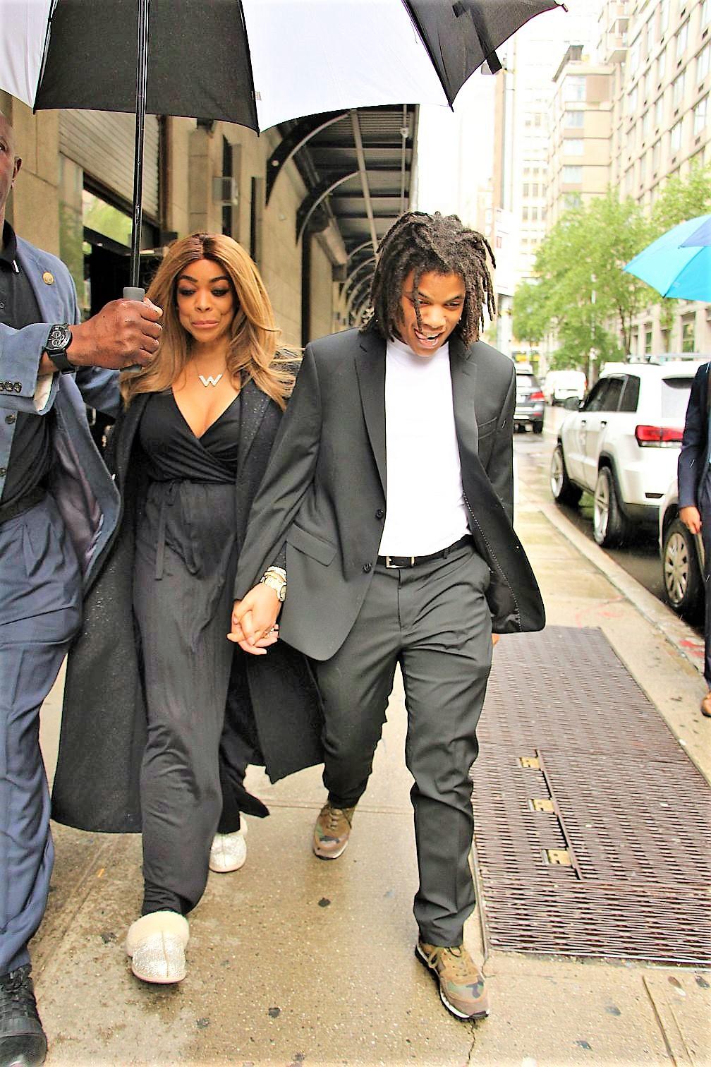 Wendy Williams and son Kevin Hunter Jr smile in the rain on their way to a Washington DC gala after arrest last night of Kevin Jr due to a fight with Kevin Hunter Sr. 23 May 2019 Pictured: Wendy Williams and Kevin Hunter Jr. 
