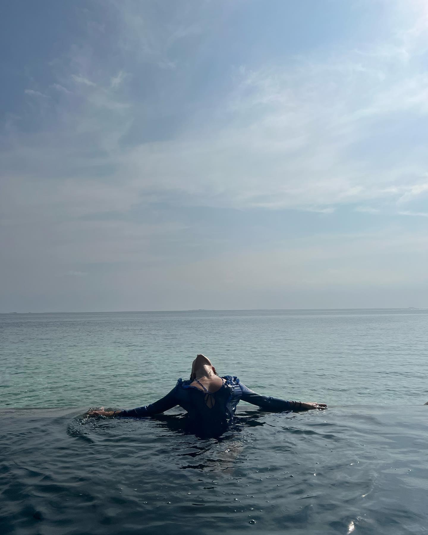 Nicole Poturalski poses in the water