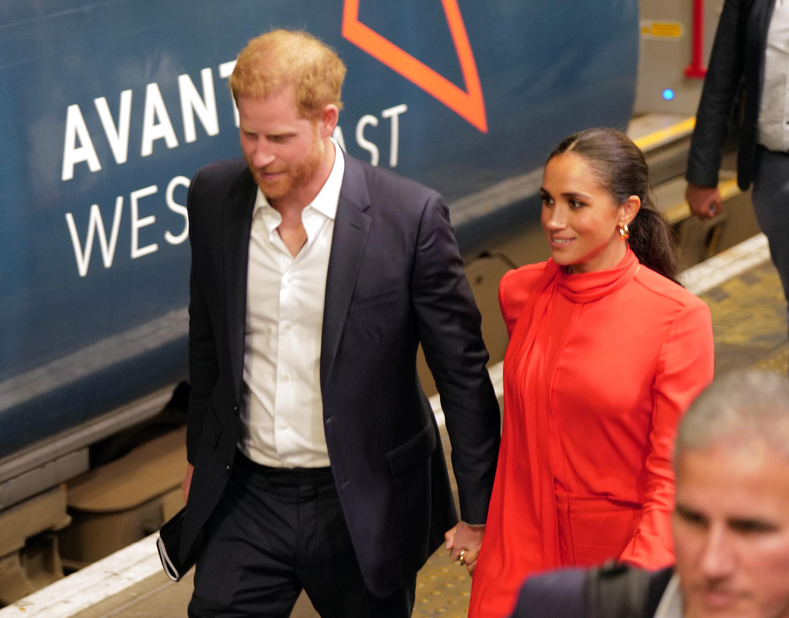 Prince Harry and Meghan Markle arrive back at Euston station in London