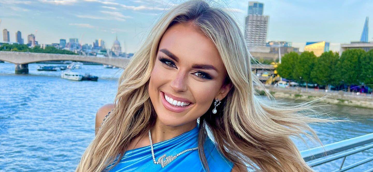Tallia Storm smiles in a blue dress