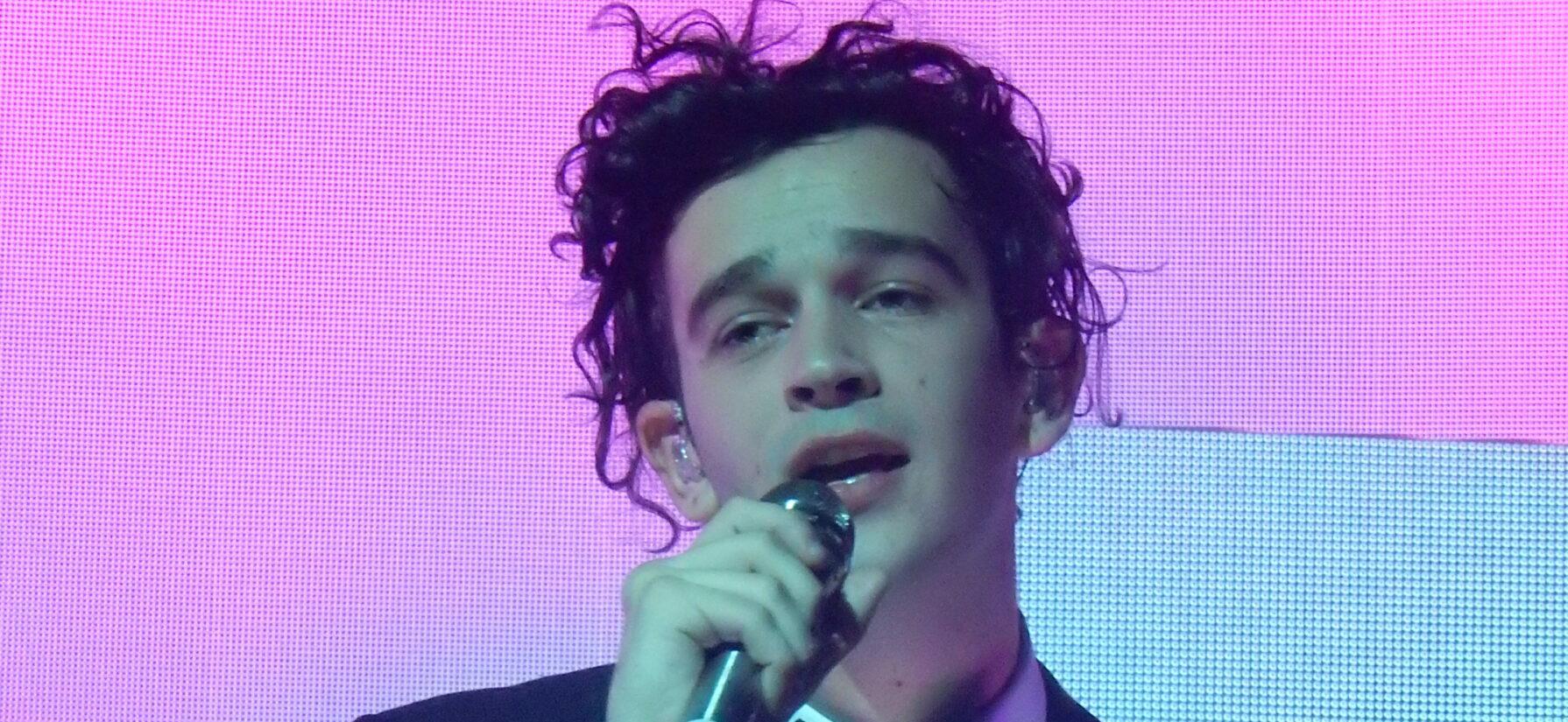 Matty Healy performing with his band The 1975
