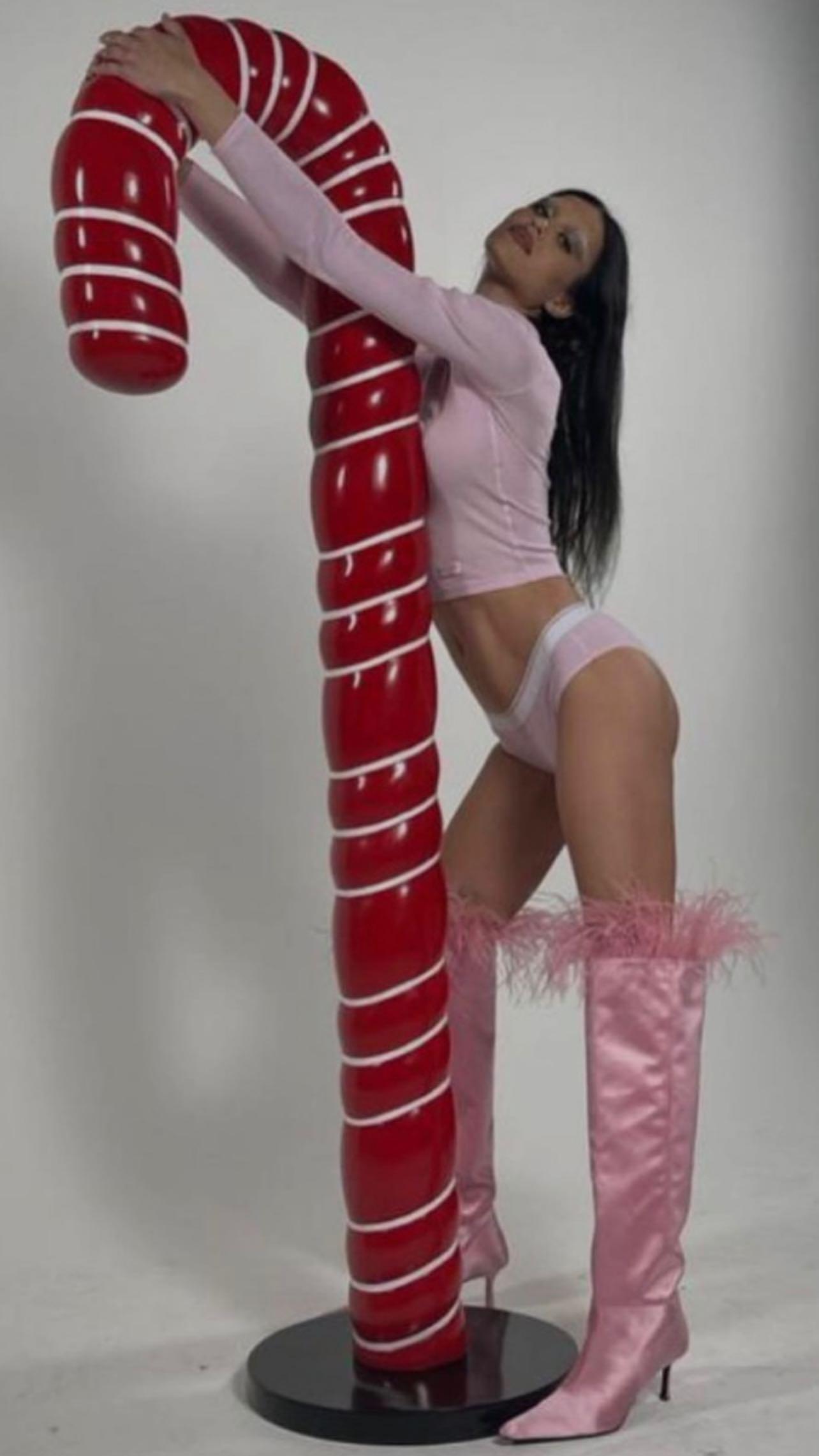 Amelia Gray Straddles A Giant Candy Cane In Panties & Boots