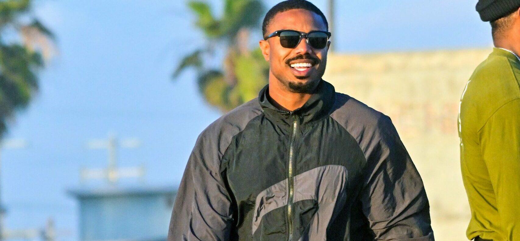Michael B Jordan is all smiles as he directs quot Creed III quot directing a shirtless Jonathan Majors