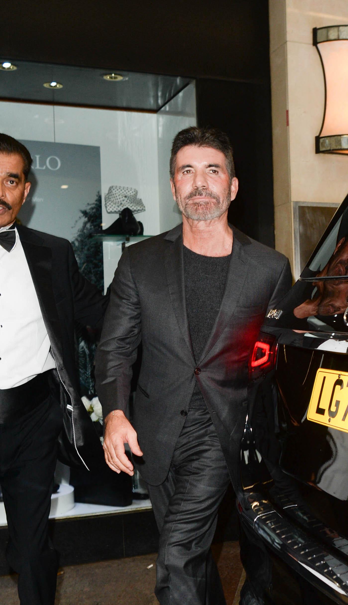 Celebrities are seen leaving the Variety Club Show business Awards at The Hilton Park Lane in London