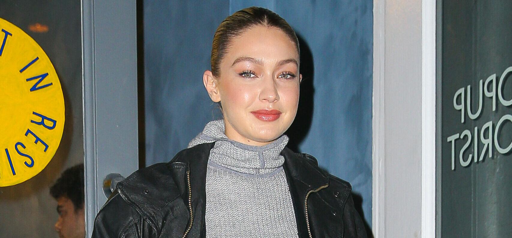 Gigi Hadid poses while arriving at the popup store of her Guest in Residence brand in New York City