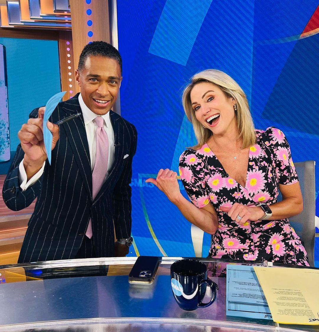Amy Robach smiling with T.J. Holmes
