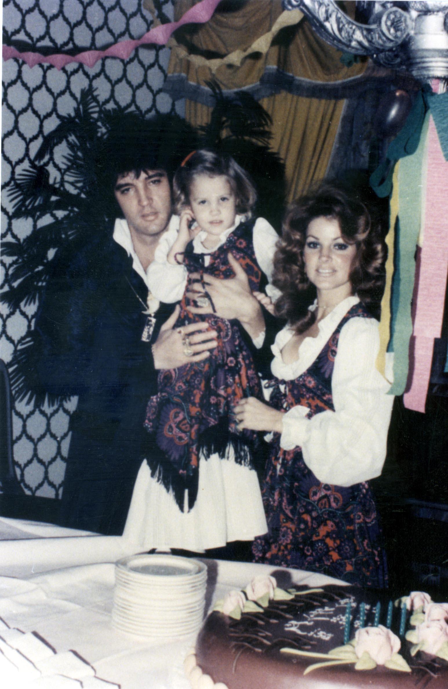 Elvis Presley and Priscilla Presley with daughter Lisa Marie Presley