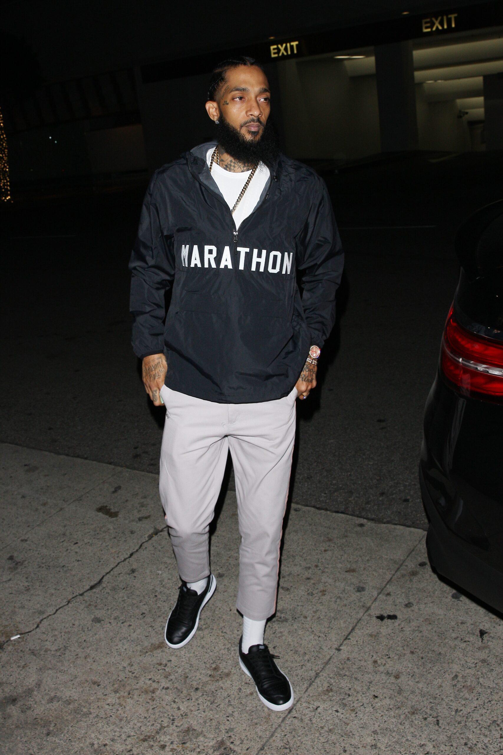Rapper Nipsey Hussle is spotted going to Madeo restaurant for dinner