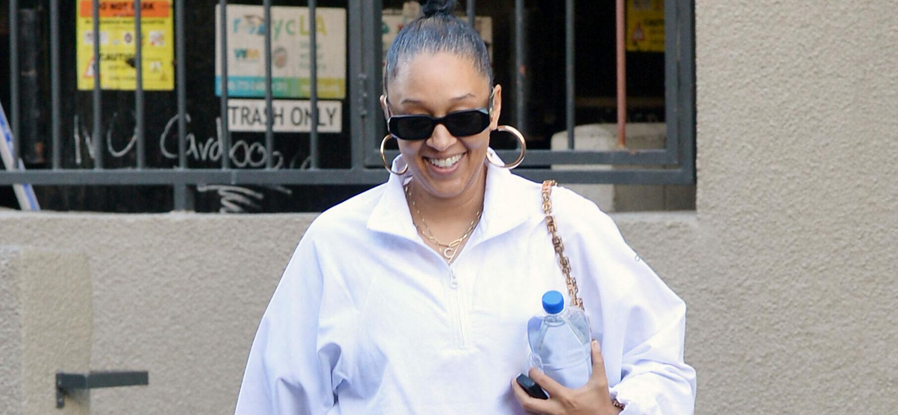 Tia Mowry is all smiles while showing off her fit body in a pair of yoga leggings while heading to the gym