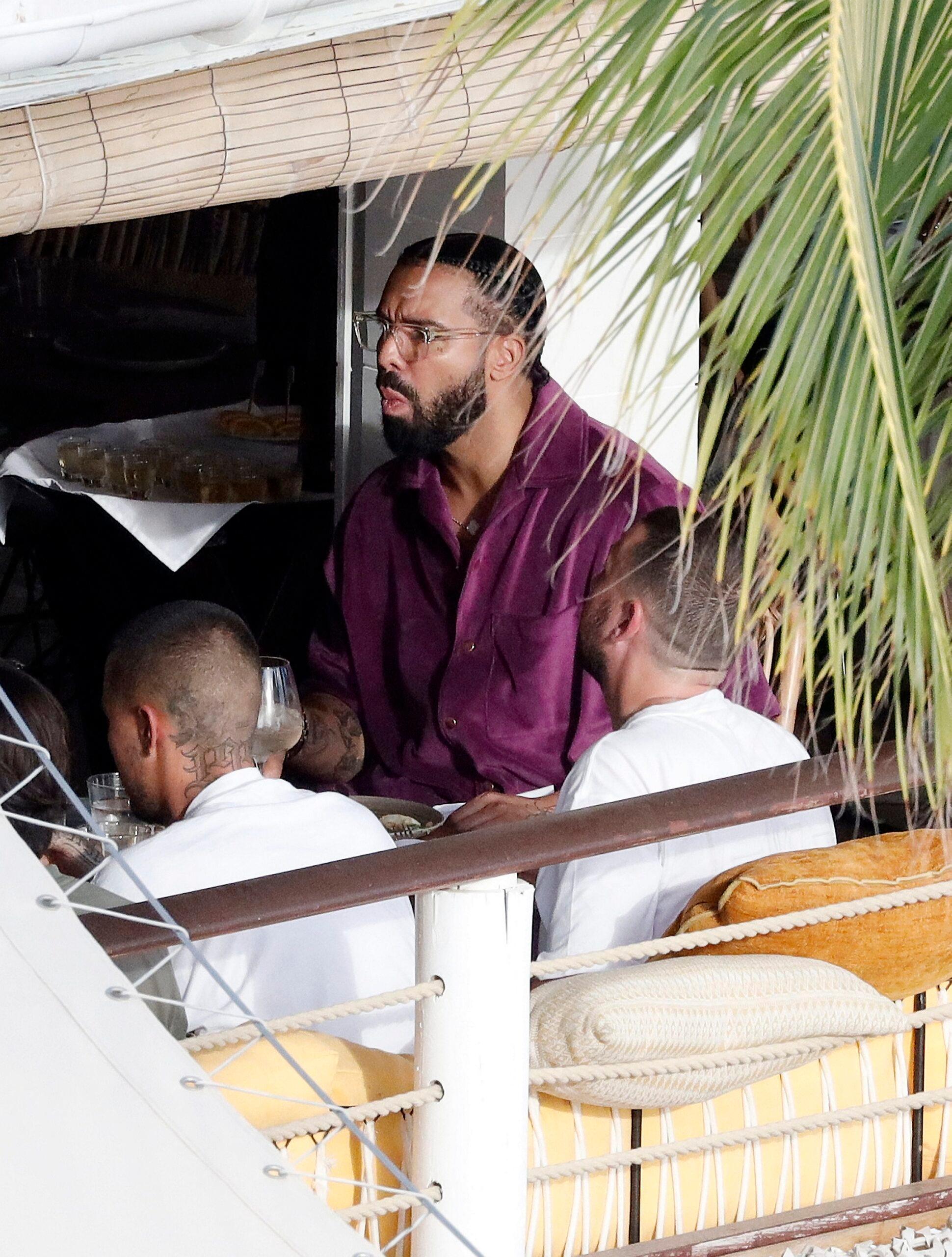 Canadian rapper Drake is seen enjoying lunch while at the Caribbean beach quot Shellona quot in St Barts