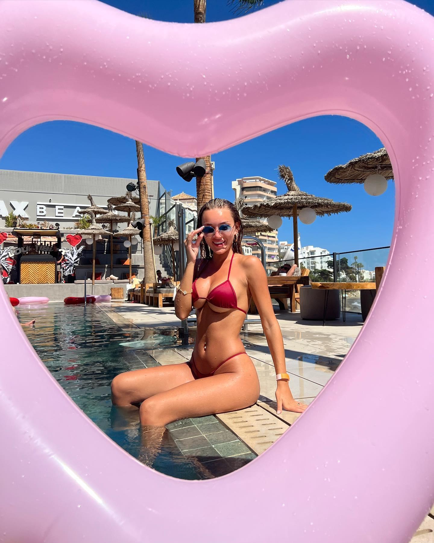Beaux Raymond shares a throwback showing her in a red bikini at the pool