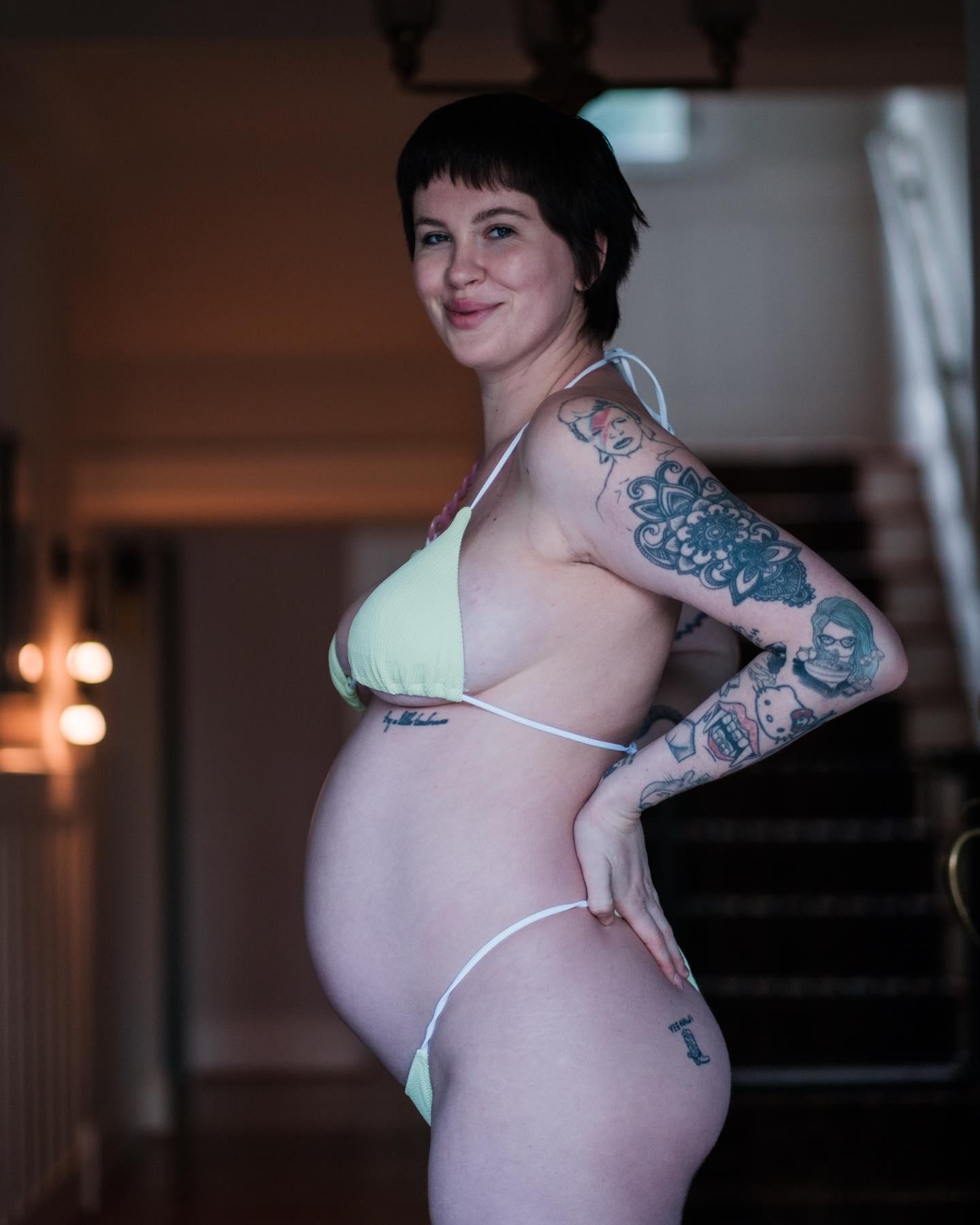 Ireland Baldwin marks the 6 month mark of her first pregnancy posing in a green bikini