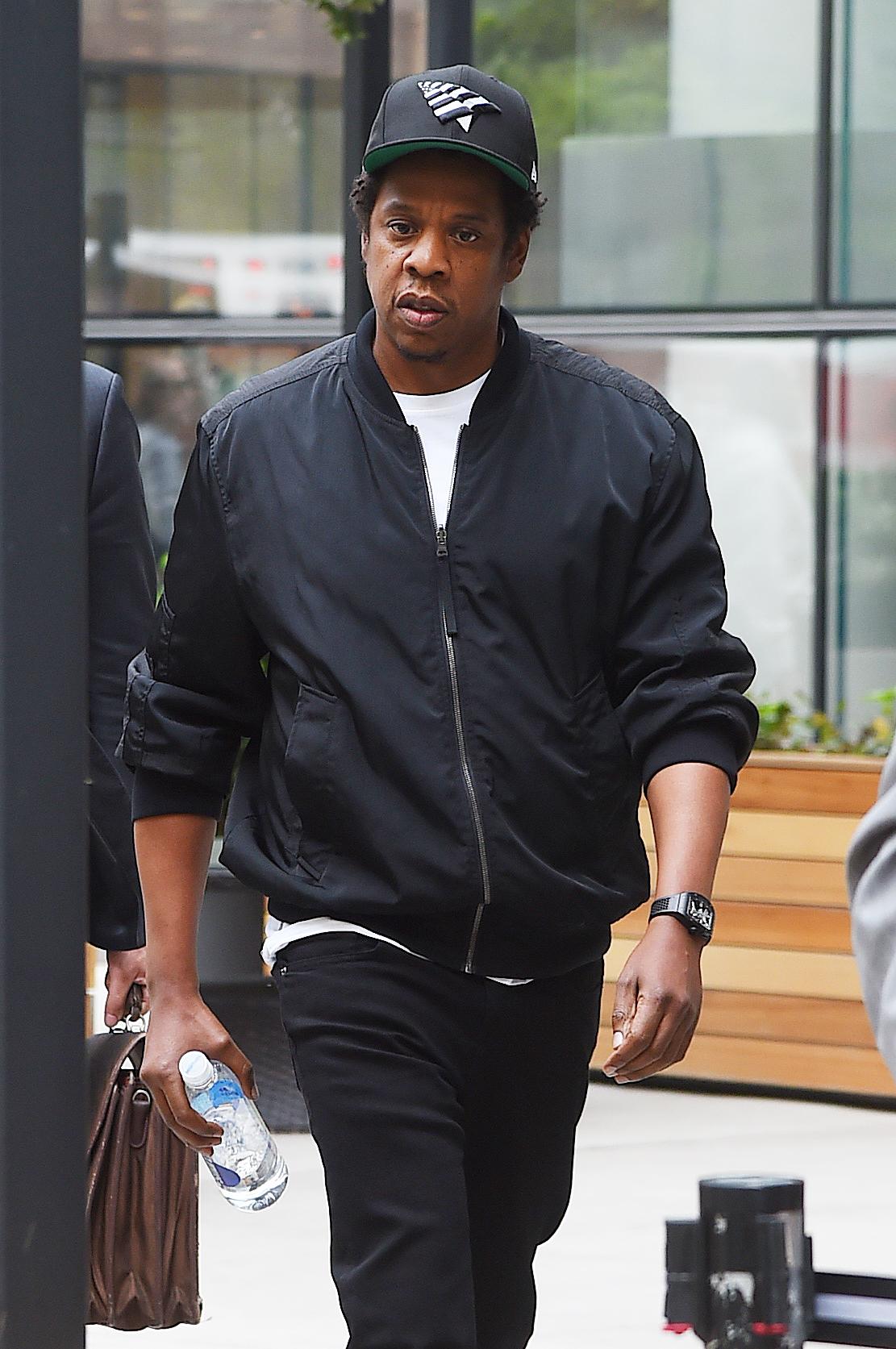 Jay-Z leaving the Securities and Exchange Commission at the bottom of Manhattan