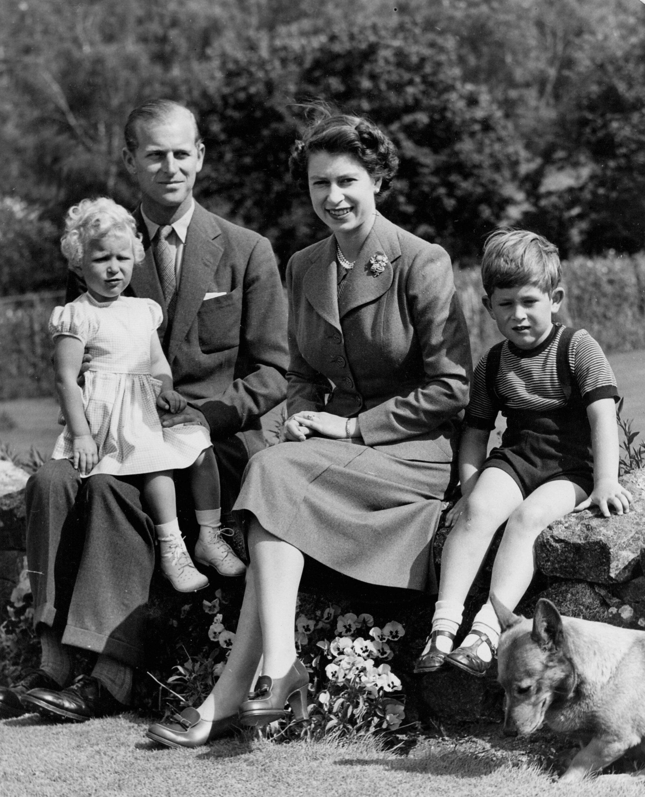 A portrait of the British Royal family including, from left, PRINCESS ANNE, PRINCE PHILIP, QUEEN ELIZABETH II, PRINCE CHARLES and one of the royal pet Corgis.