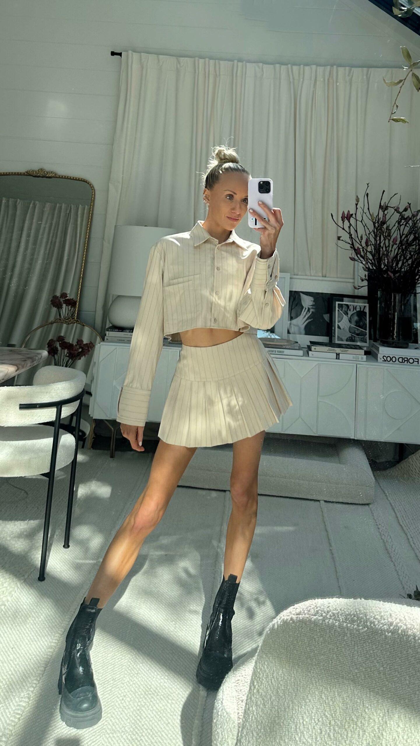 Nastia Liukin shares a get ready with me (GRWM) video in a tan skort and jacket