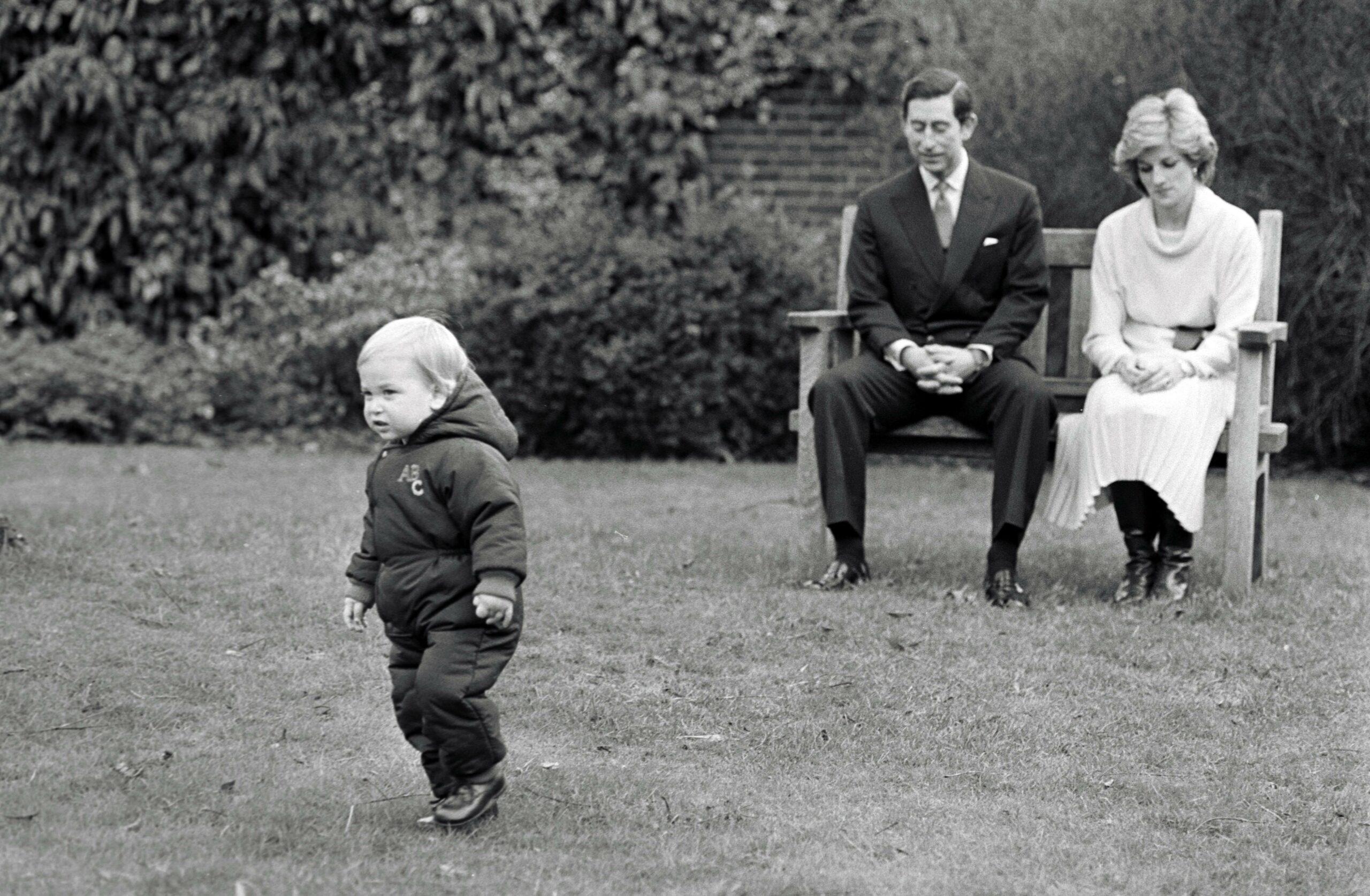 Prince Charles and Princess Diana watch Prince William as he appears at a photocall in the gardens of Kensington Palace, December 1983