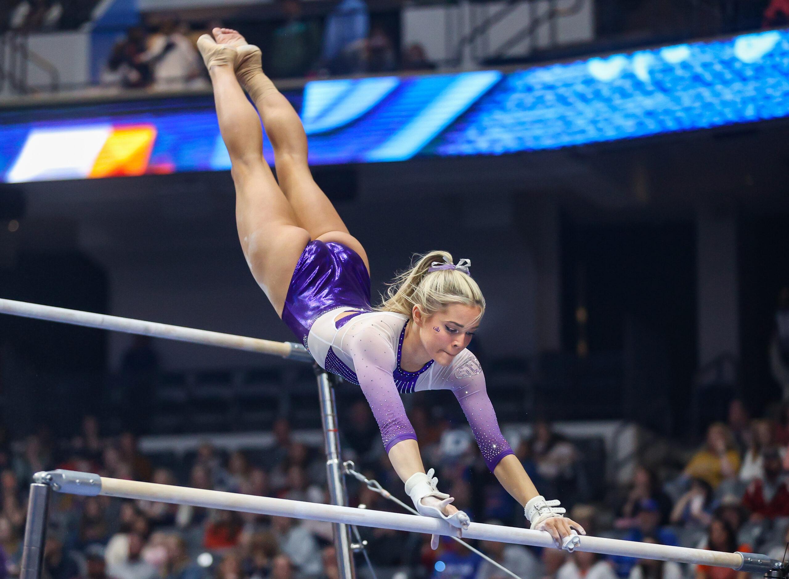 March 19, 2022: LSU's Olivia Dunne transitions between the bars during the 2022 SEC Women's Gymnastics Championships at Legacy Arena in Birmingham, AL. Kyle Okita/CSM(Credit Image: © Kyle Okita/Cal Sport Media) Newscom/(Mega Agency TagID: csmphototwo885846.jpg) [Photo via Mega Agency]