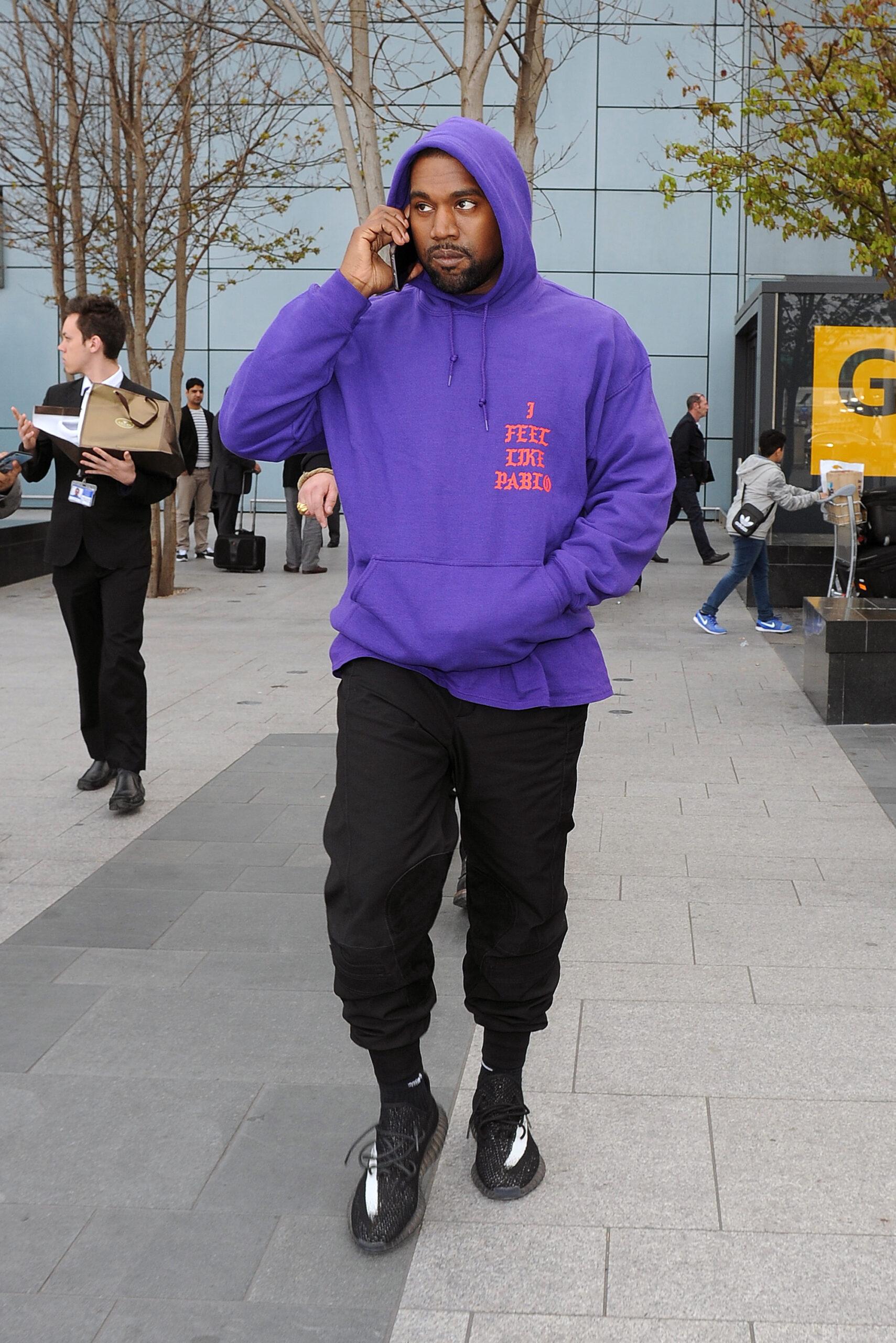 Kanye West arriving at Heathrow Airport all smiles Kanye was wearing an as yet unreleased pair of his Yeezy Boost 350 trainers as well as a Pablo hoodie to promote his new album