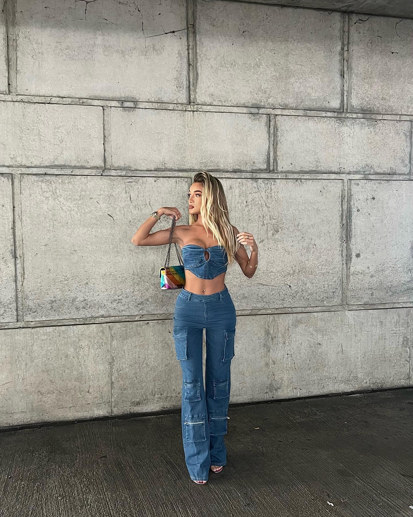 Beaux Raymond poses in a strapless denim crop top