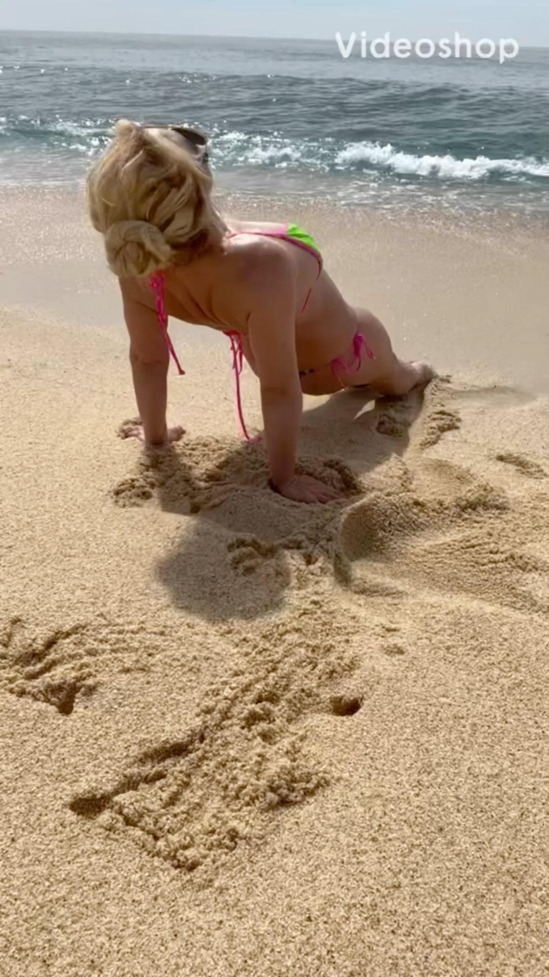 Britney Spears Rolls Around On The Beach In A Drawstring Bikini