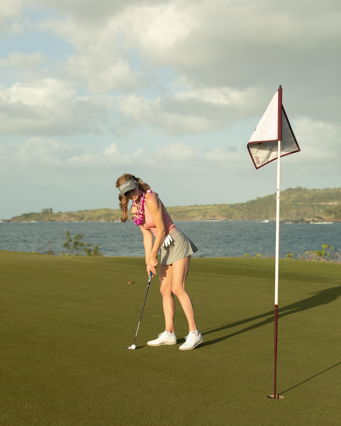 Grace Charis golfs in her busty crop top in Hawaii 