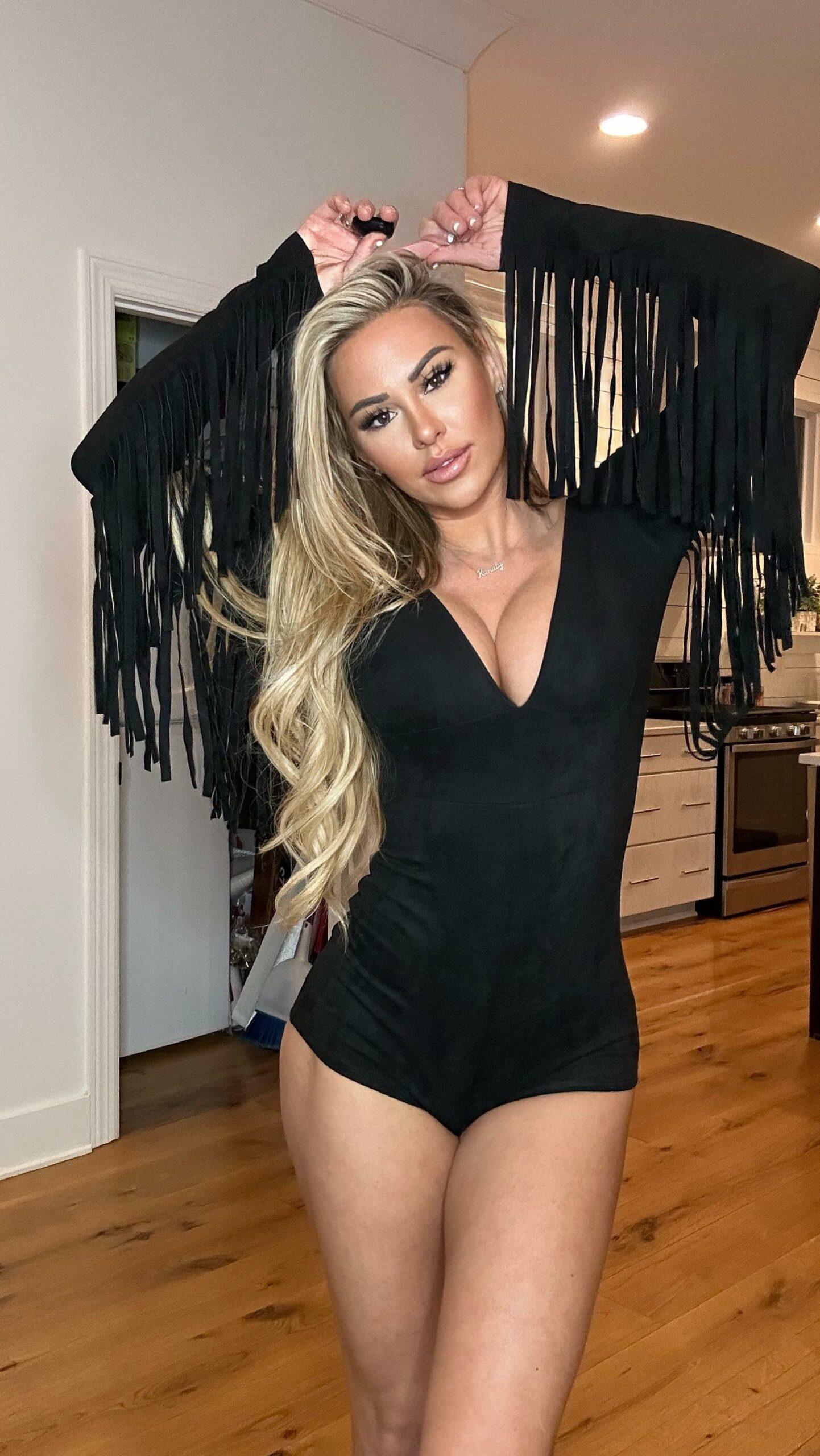 Kindly Myers in a black bodysuit