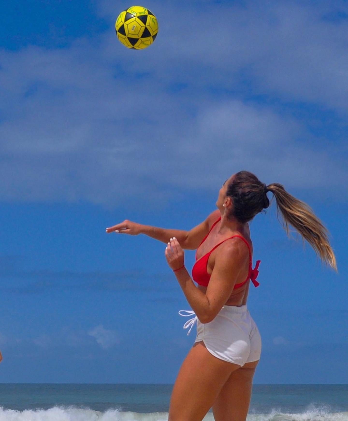 Natalia Guitler plays ball in her red bikini