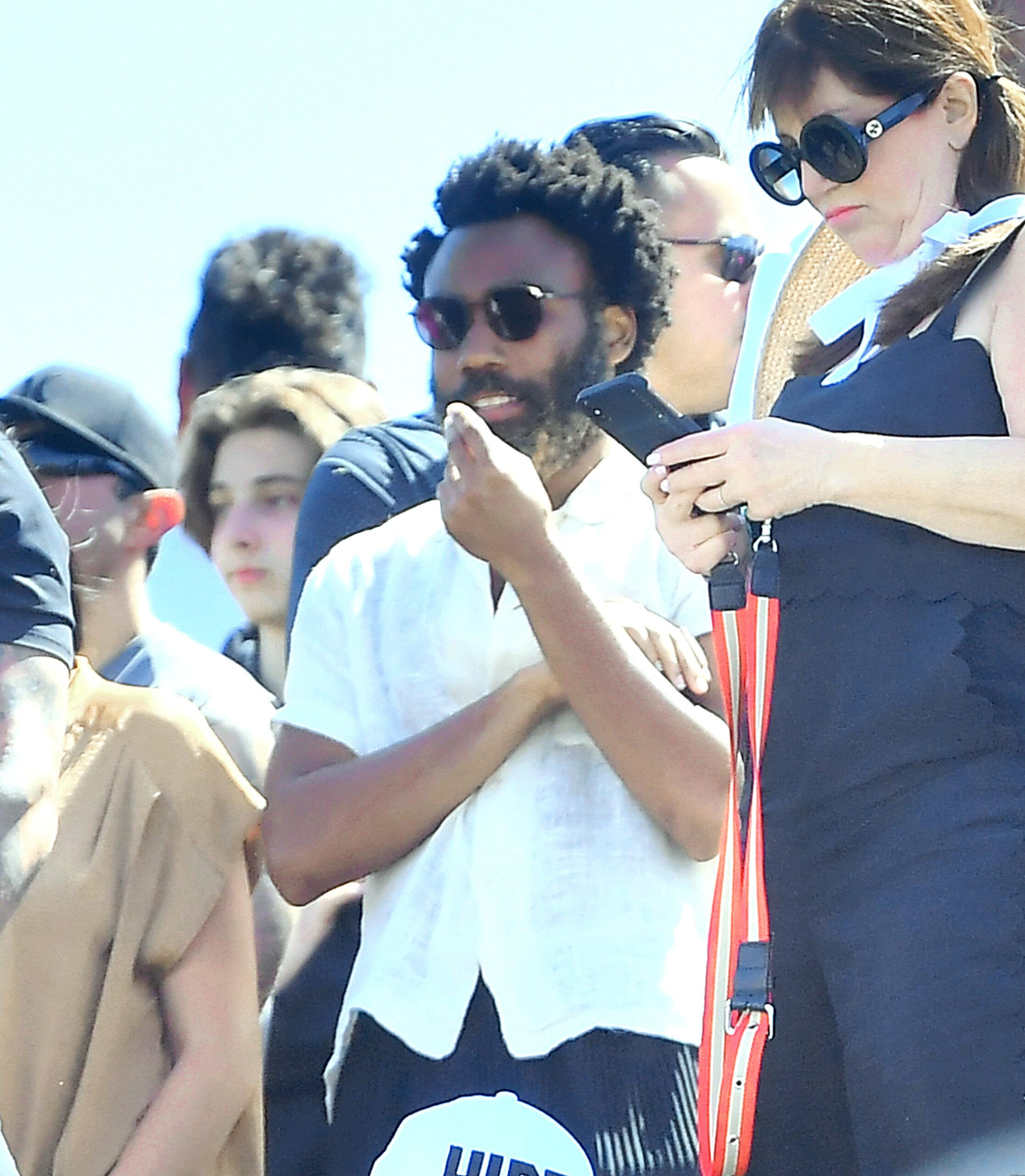 Hailey Baldwin and Donald Glover aka Childish Gambino hang out with Kendall Jenner and the rest of the Kardashian clan at Kanye West apos s apos Church Sunday Services apos at Coachella in Indio CA