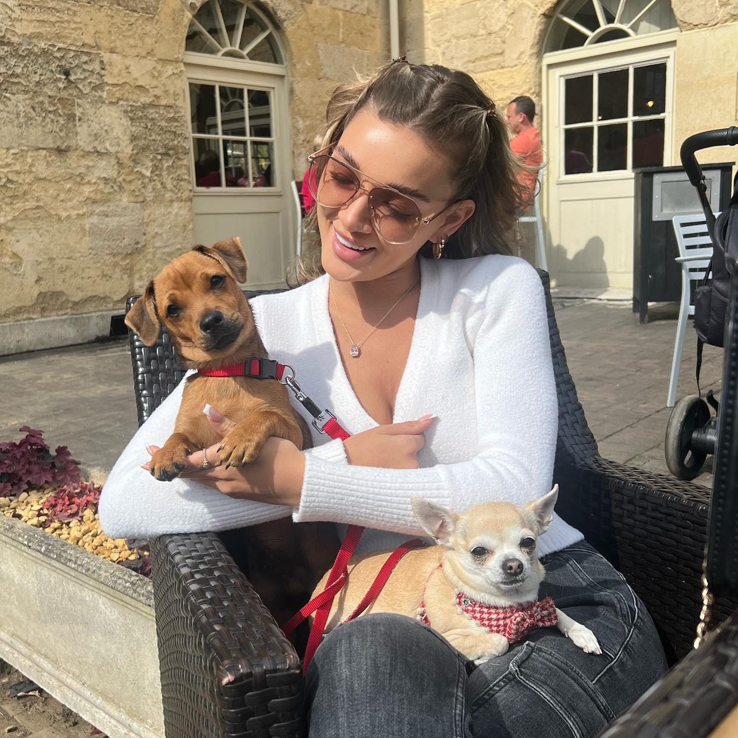 Beaux Raymond poses with her two dogs