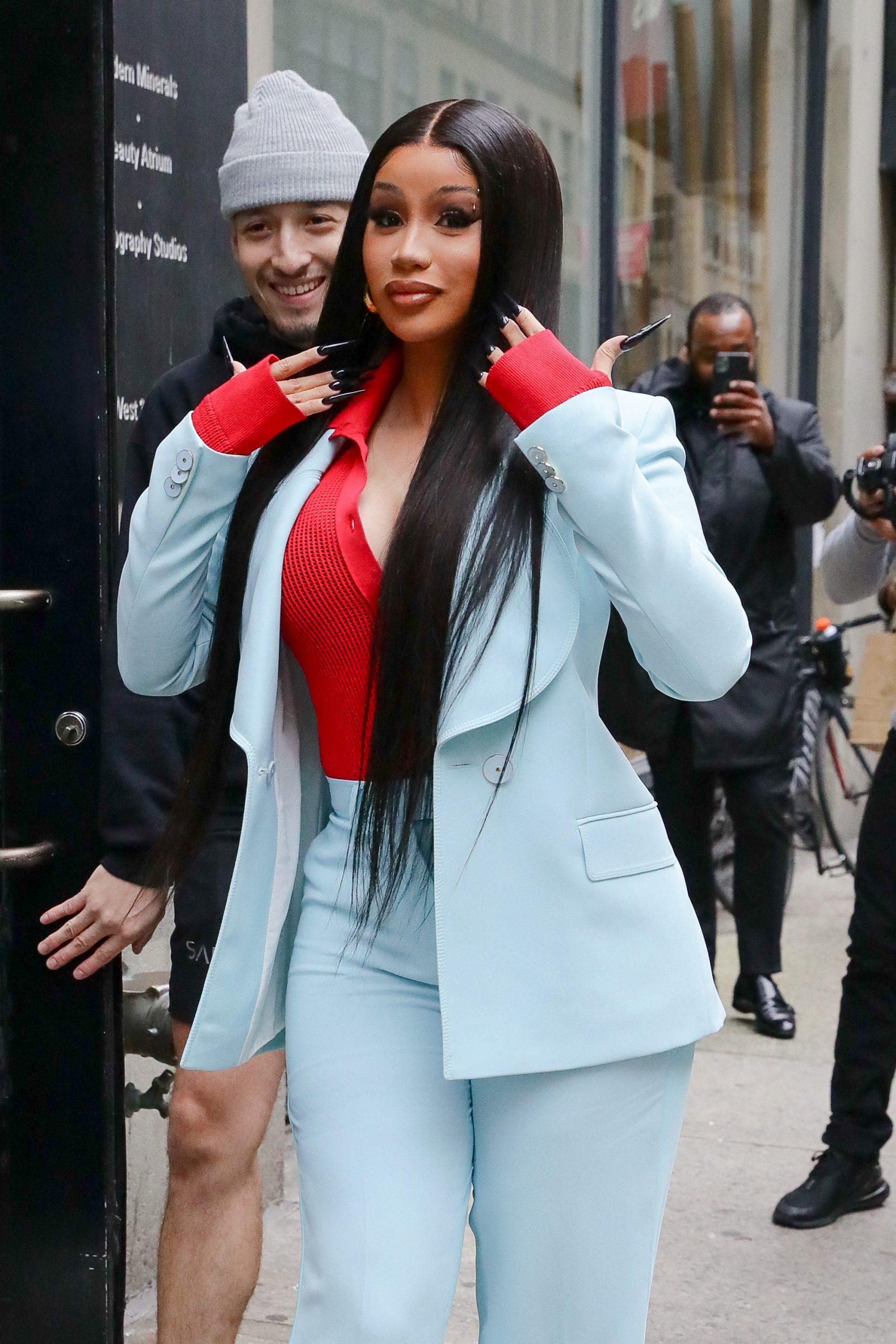 Cardi B looks looks radiant in a light blue suit as arriving at an office building in NYC