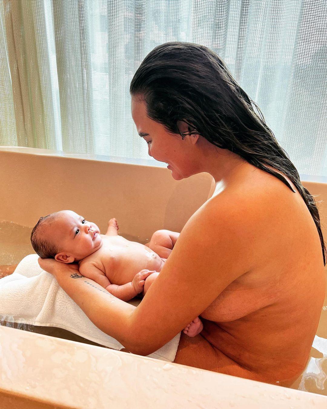Chrissy Teigen Doesn't Care About 'Boob That Hangs' While In The Bathtub With Her Newborn