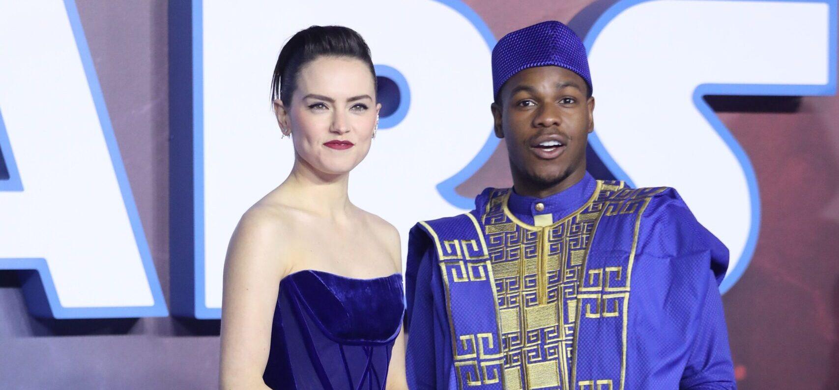 Daisy Ridley and John Boyega pose together at Star Wars premiere