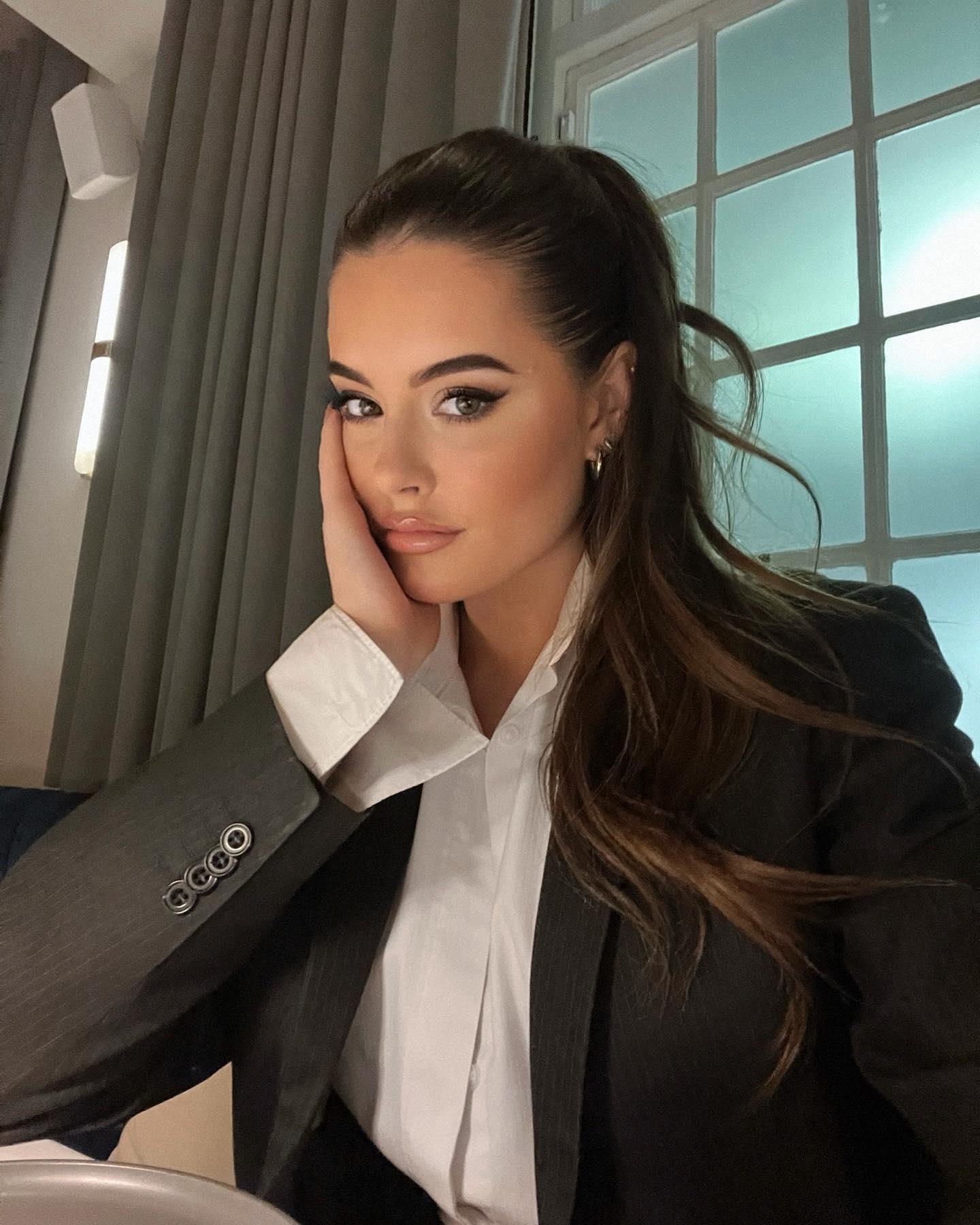 Sophie Stonehouse poses in a suit