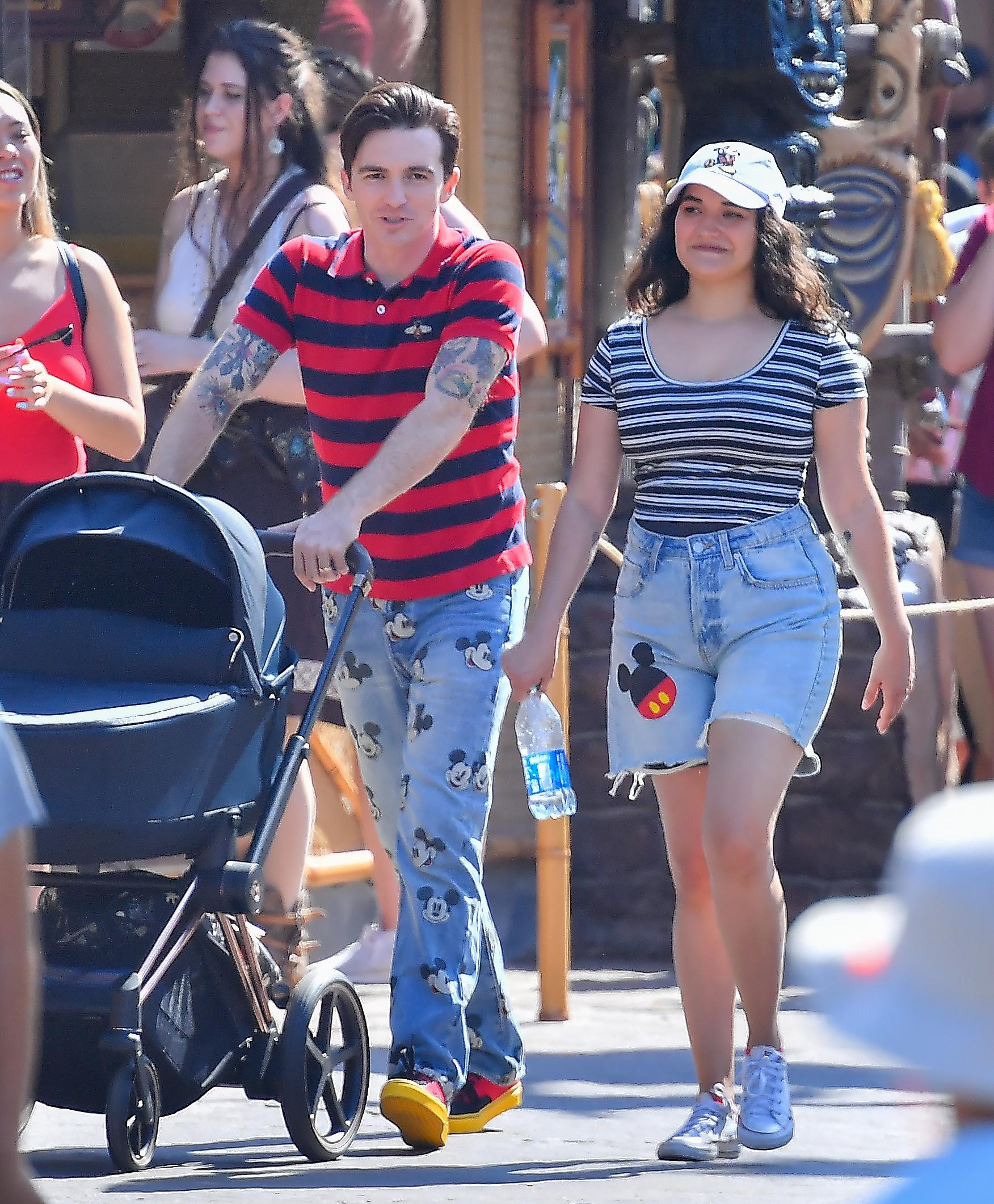 Drake Bell is seen for the first time since pleading guilty to child endangerment with a women who is believed to be his wife and a baby at Disneyland The actor was seen celebrating his 35th birthday with his little family putting his legal woes behind