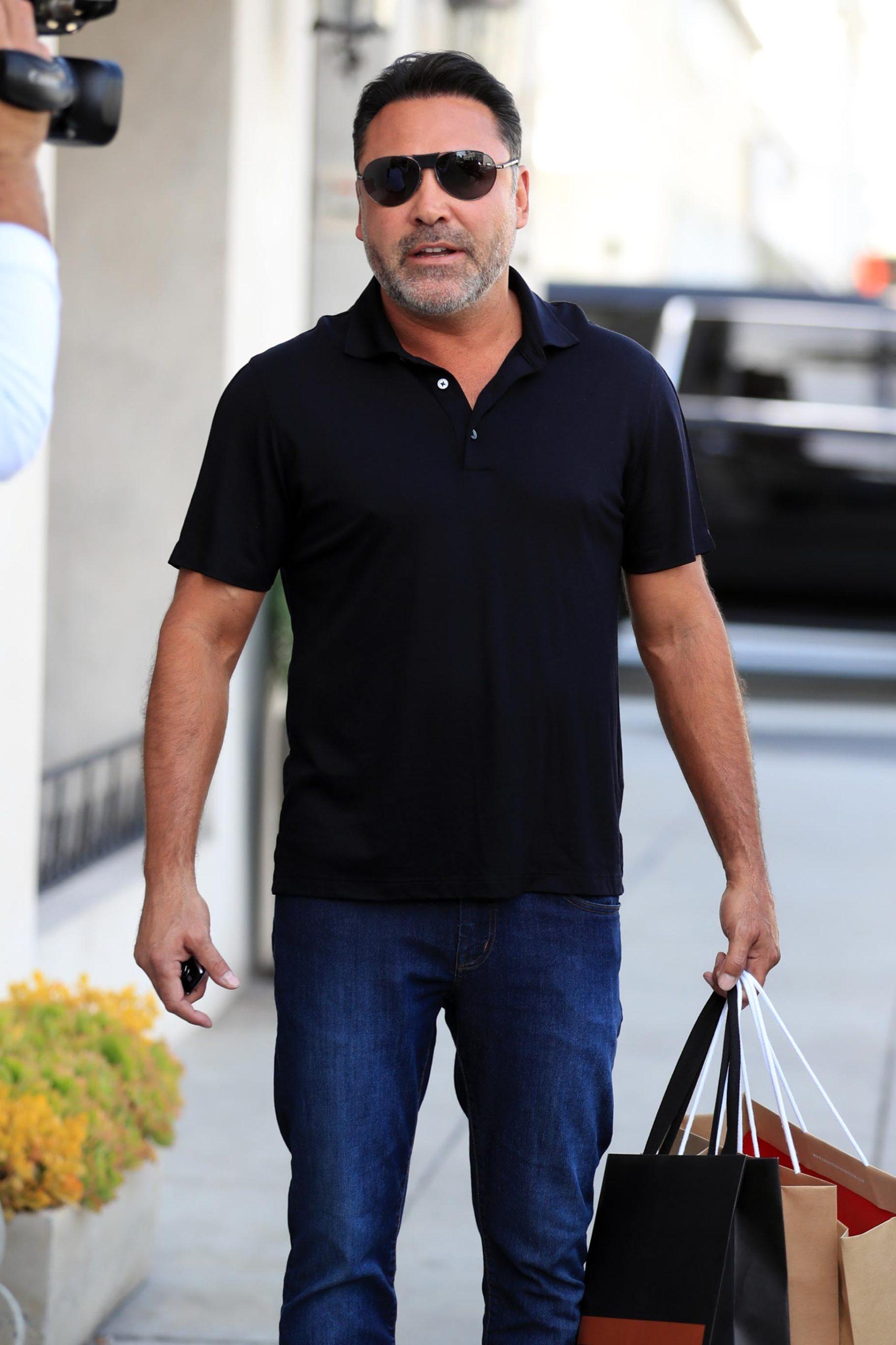 Oscar De La Hoya amp Holly Sonders are seen leaving Christian Louboutin store in Beverly Hills