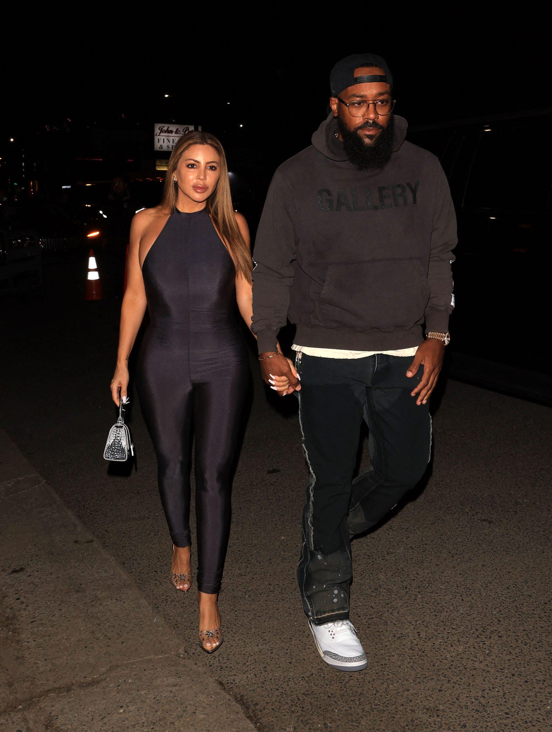 Larsa Pippen and Boyfriend Marcus Jordan walk hand-in-hand as they arrive for dinner at Catch Steak LA